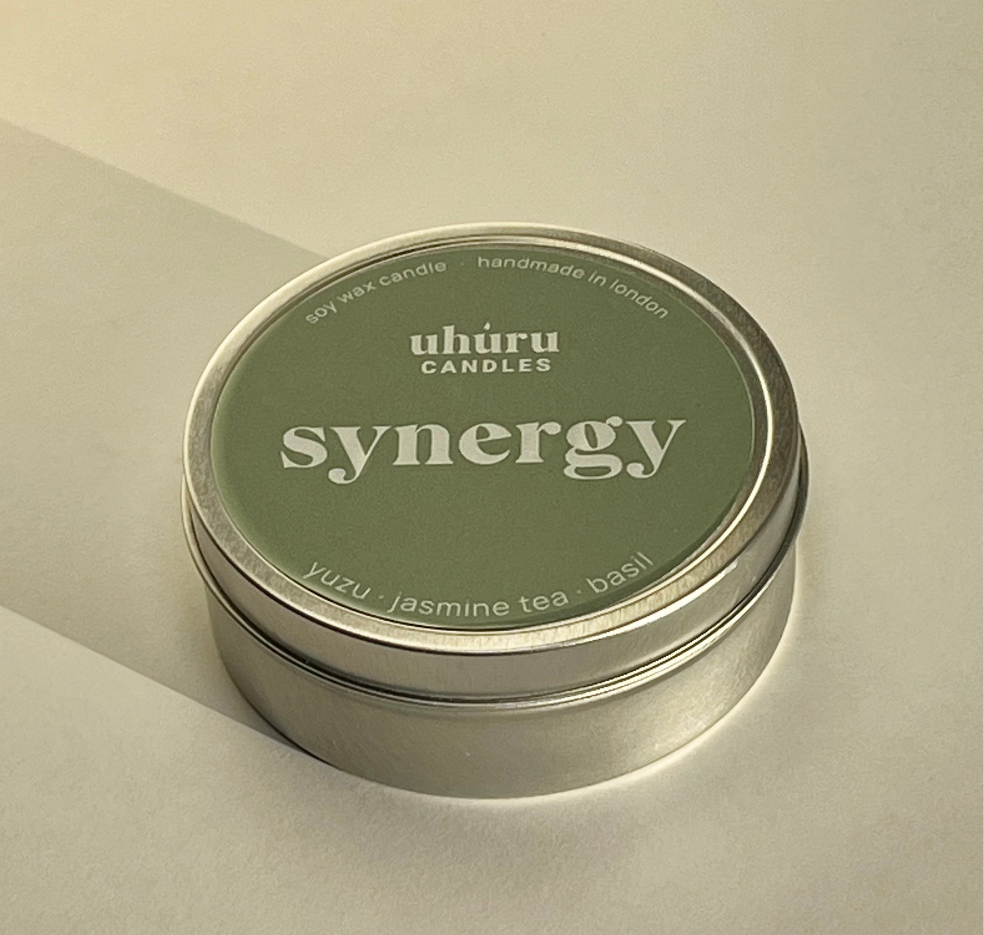 Synergy by Uhuru Candles - yuzu, jasmine tea and basil scented soy wax candle in metal tin container. Tin net weight 70g.